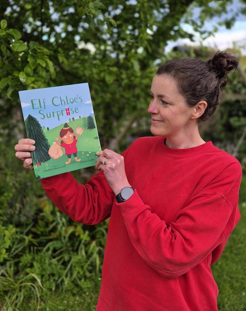charlotte mason-curl with book elf chloe's surprise
